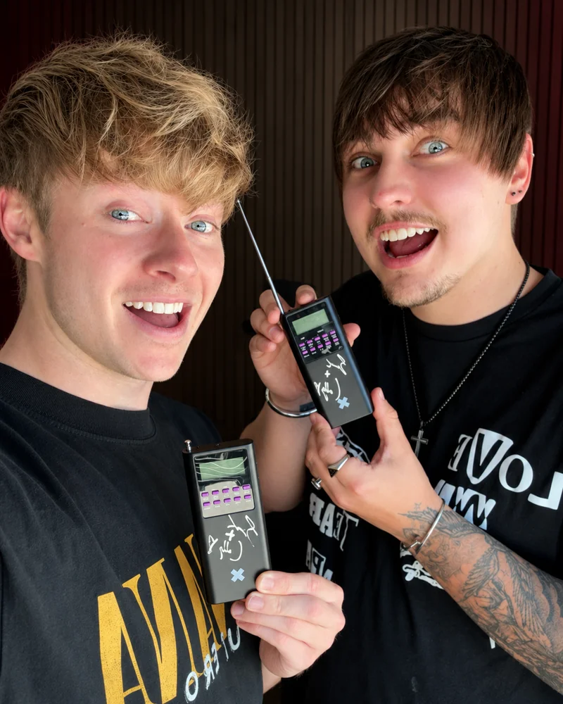 Us holding two autographed spirit boxes.